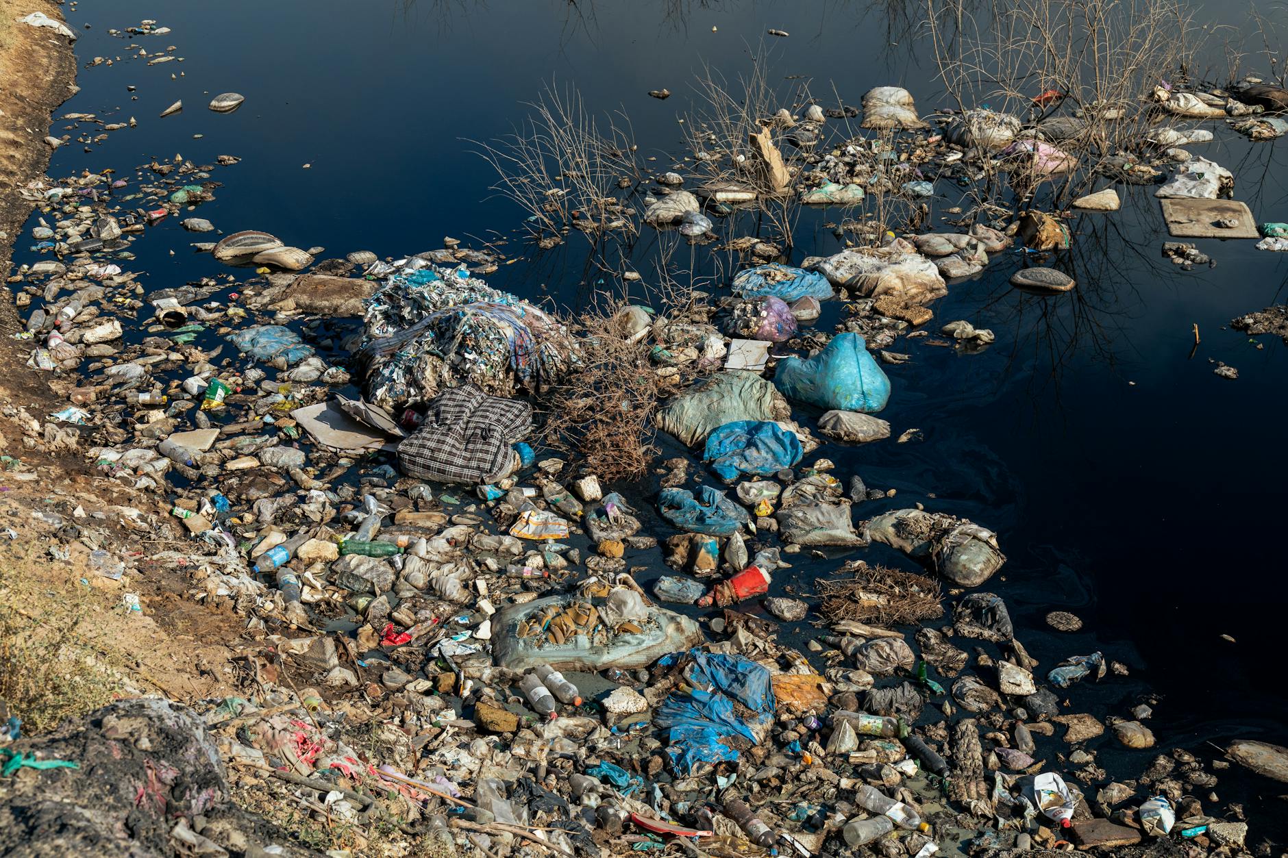 plastic waste on a riverbank